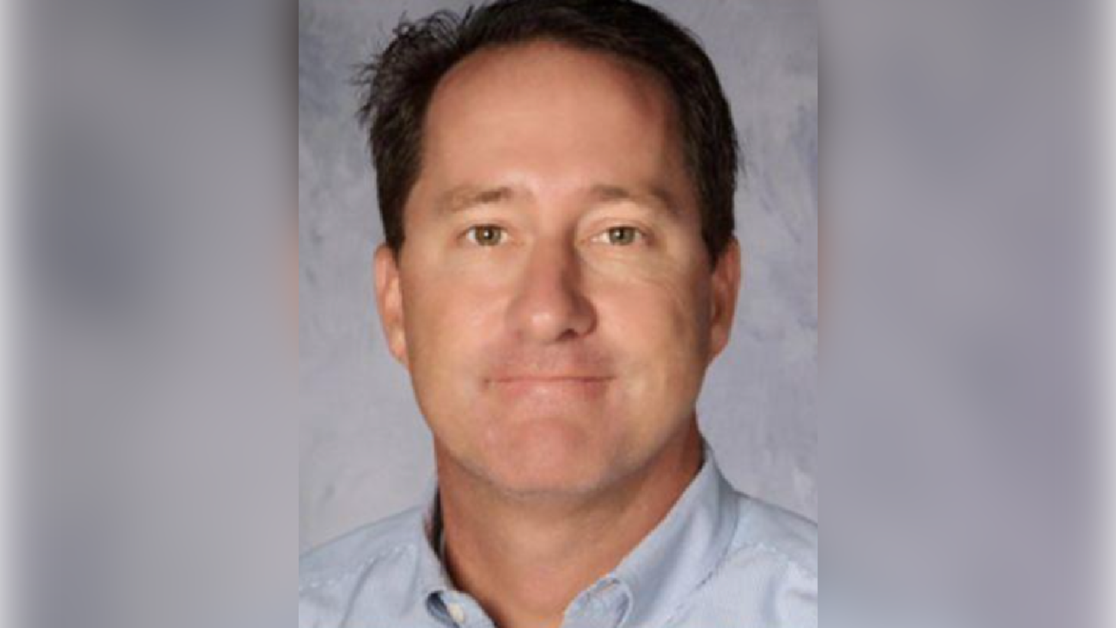 James Cecil looks forward in a headshot.