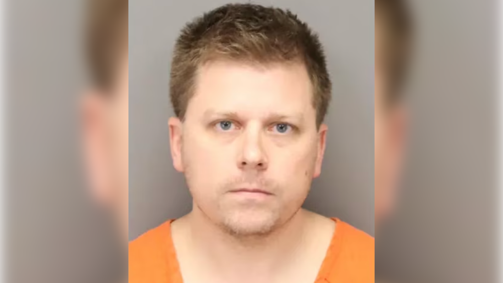 Patrick Scruggs, wearing an orange jumpsuit, stares forward in a mugshot.