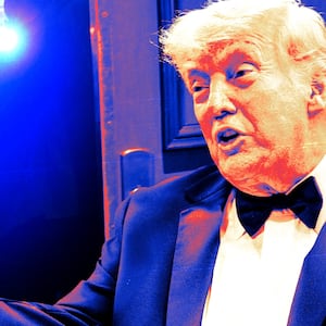 Donald Trump gestures to come inside the White House Correspondents Dinner.