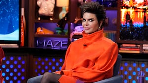 Lisa Rinna wears oversized red coat on the set of Watch What Happens Live