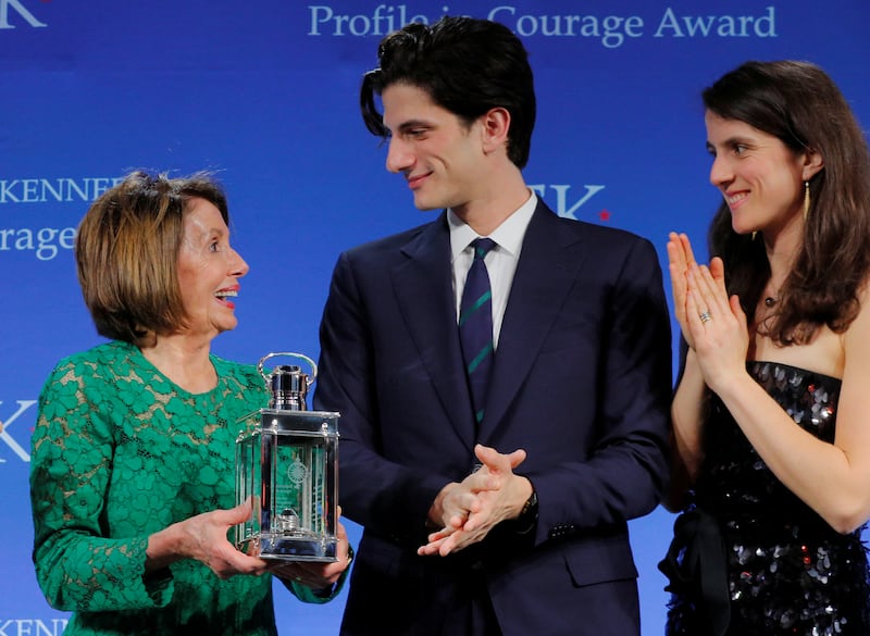 U.S. House Speaker Nancy Pelosi (D-CA) accepts the 2019 Profile in Courage Award from Jack (C) and Tatiana (R) Schlossberg at the John F. Kennedy Presidential Library in Boston, Massachusetts, U.S., May 19, 2019.