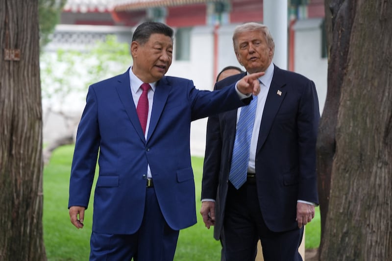 President Donald Trump talks with China’s President Xi Jinping at the Zhongnanhai leadership compound, Friday, May 15, 2026, in Beijing.  Mark Schiefelbein/Pool via REUTERS