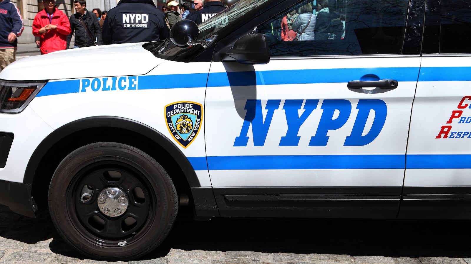 A New York City police SUV with two NYPD counter terrorism officers sits on Broadway in New York.