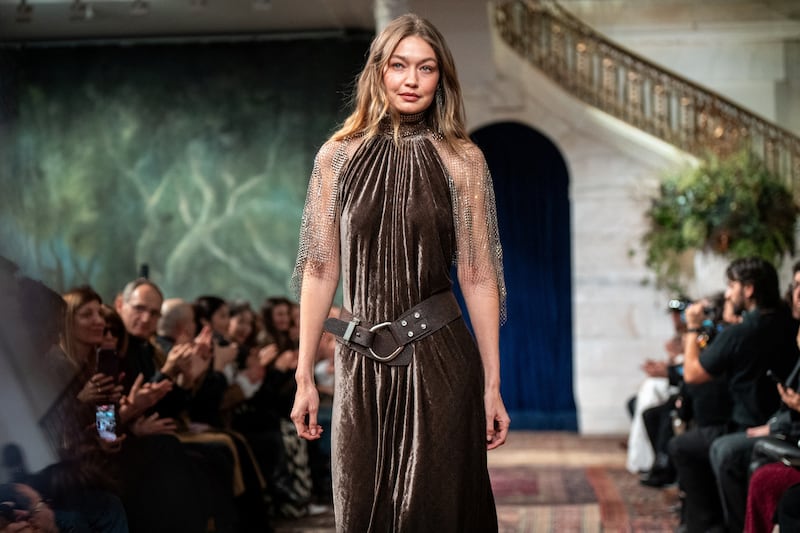 Gigi Hadid presents a creation from the Fall 2026 Ralph Lauren collection during New York Fashion Week in New York City, U.S., February 10, 2026.