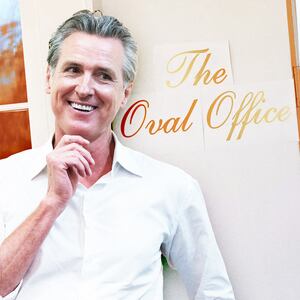 A photo illustration of Gov. Gavin Newsom and the temporary signage reading "The Oval Office" is displayed next to an entrance to the Oval Office at the White House.