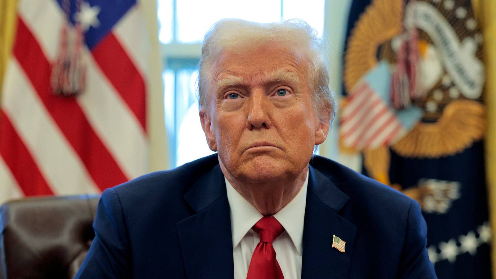 WASHINGTON, DC - JANUARY 30: U.S. President Donald Trump talks to reporters from the Resolute Desk after signing an executive order to appoint the deputy administrator of the Federal Aviation Administration in the Oval Office at the White House on January 30, 2025 in Washington, DC. Trump also signed a memorandum ordering an immediate assessment of aviation safety and ordering an elevation of what he called “competence” over “D.E.I.” (Photo by Chip Somodevilla/Getty Images)