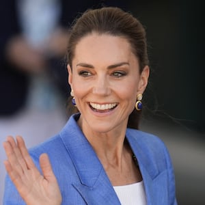 Britain's Catherine, Princess of Wales waves as she walks through the grounds on the fourth day of the 2026 Wimbledon Championships at The All England Lawn Tennis and Croquet Club in Wimbledon, southwest London, on July 2, 2026. (Photo by Andrew Matthews / POOL / AFP via Getty Images) / RESTRICTED TO EDITORIAL USE - No commercial use without prior written consent of the AELTC. Just still image use - no moving images to emulate broadcast. No superimposing or removal of sponsor/ad logos.