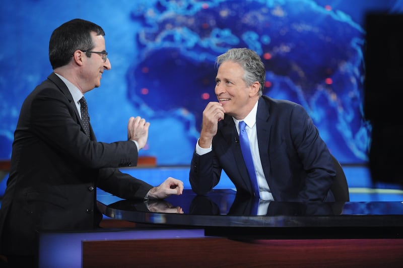 John Oliver and host Jon Stewart appear on "The Daily Show with Jon Stewart"  2015