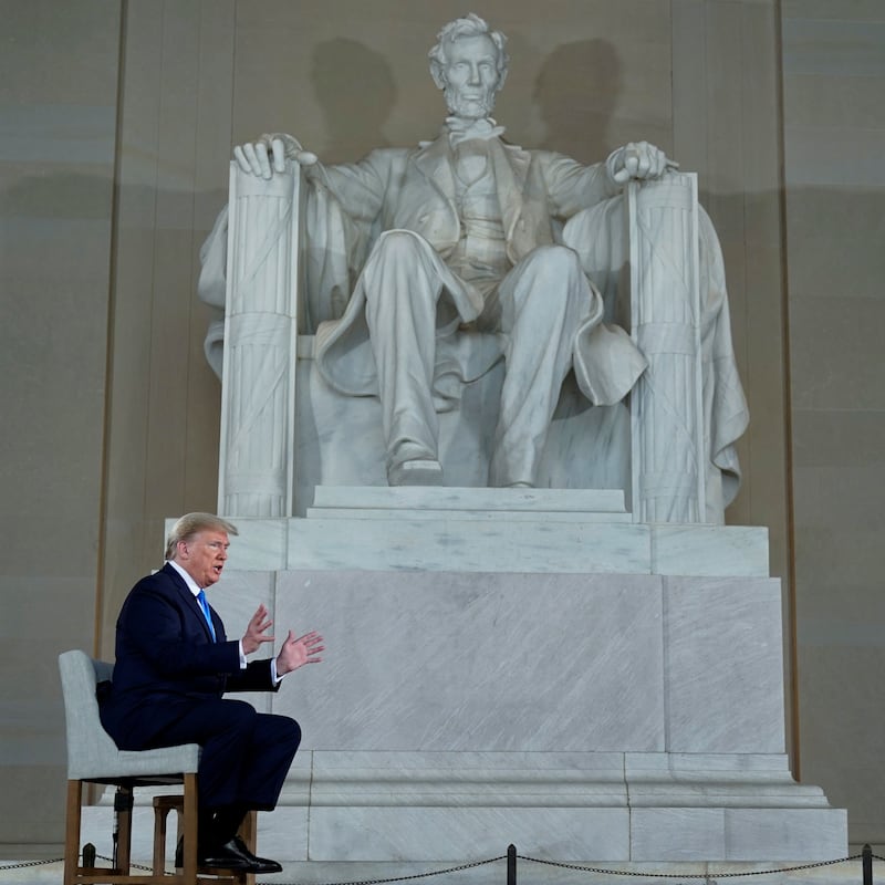 U.S. President Donald Trump is interviewed by hosts hosts Bret Baier and Martha MacCallum during a Fox News Channel virtual town hall called "America Together: Returning to Work" about the response to the coronavirus disease (COVID-19) pandemic while sitting in front of the statue of former President Abraham Lincoln inside the Lincoln Memorial in Washington, U.S. May 3, 2020.  REUTERS/Joshua Roberts