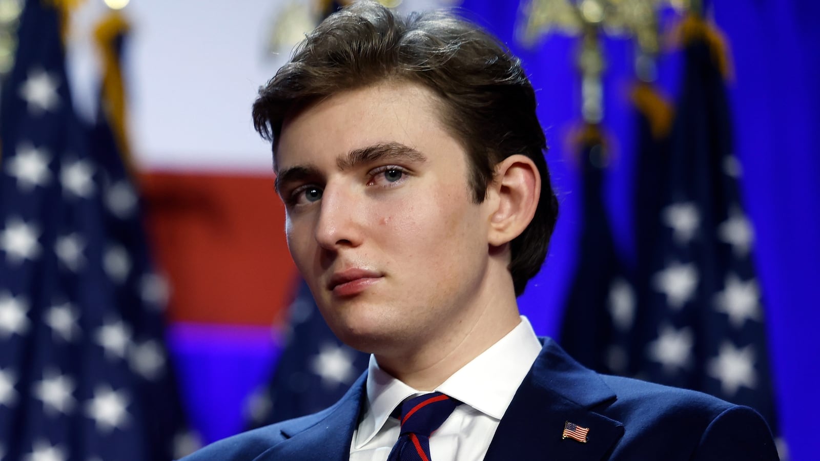 WEST PALM BEACH, FLORIDA - NOVEMBER 06: Former first lady Melania Trump and Barron Trump look on as Republican presidential nominee, former U.S. President Donald Trump speaks during an election night event at the Palm Beach Convention Center on November 06, 2024 in West Palm Beach, Florida. Americans cast their ballots today in the presidential race between Republican nominee former President Donald Trump and Vice President Kamala Harris, as well as multiple state elections that will determine the balance of power in Congress. (Photo by Chip Somodevilla/Getty Images)
