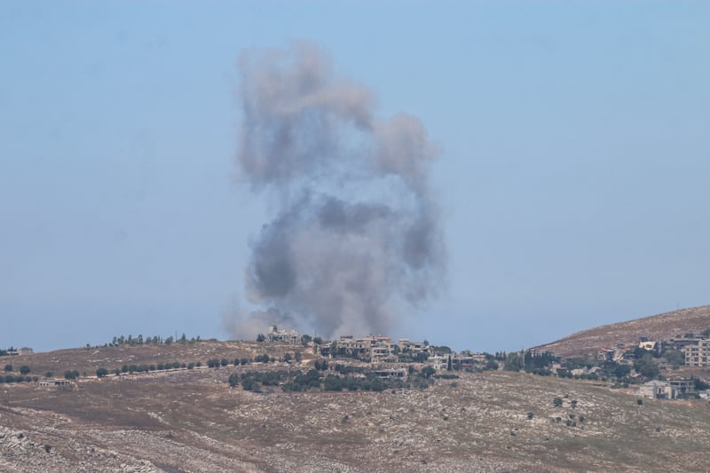 Smoke rises from the town of Kfar Tebnit and the Ali al-Tahir hill area in the Nabatieh Governorate of southern Lebanon following Israeli airstrikes on June 19, 2026. The attacks were carried out despite the U.S.-Iran agreement.