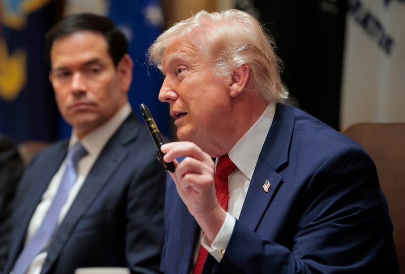 President Donald Trump holds up a Sharpie marker as he speaks during a Cabinet meeting in the Cabinet Room of the White House on March 26, 2026.