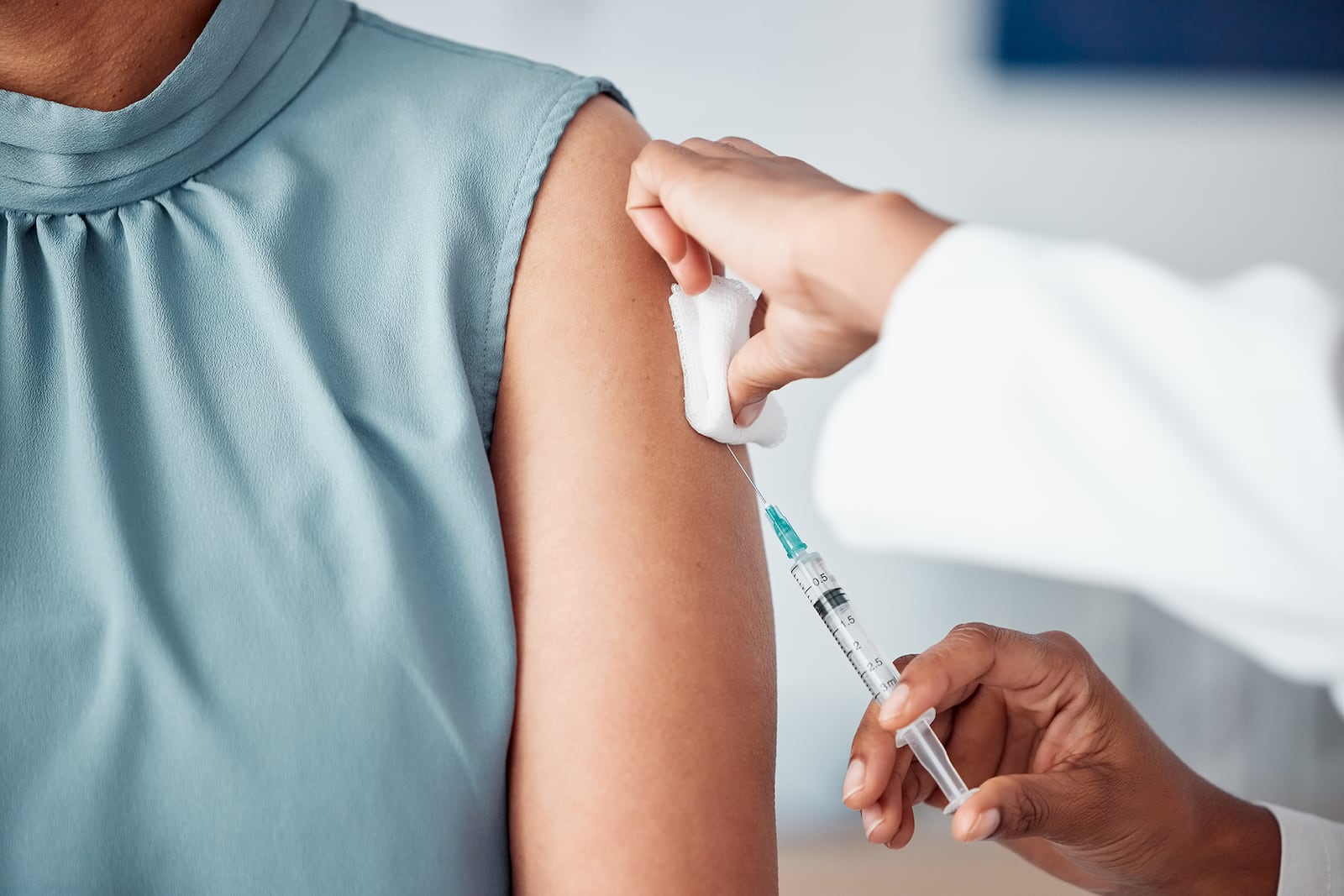 A woman receiving a flu vaccine shot.