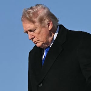 US President Donald Trump disembarks from Air Force One upon arrival at Joint Base Andrews in Maryland, March 23, 2026. Trump is returning to the White House after participating in the Memphis Safe Task Force Roundtable. (Photo by SAUL LOEB / AFP via Getty Images)
