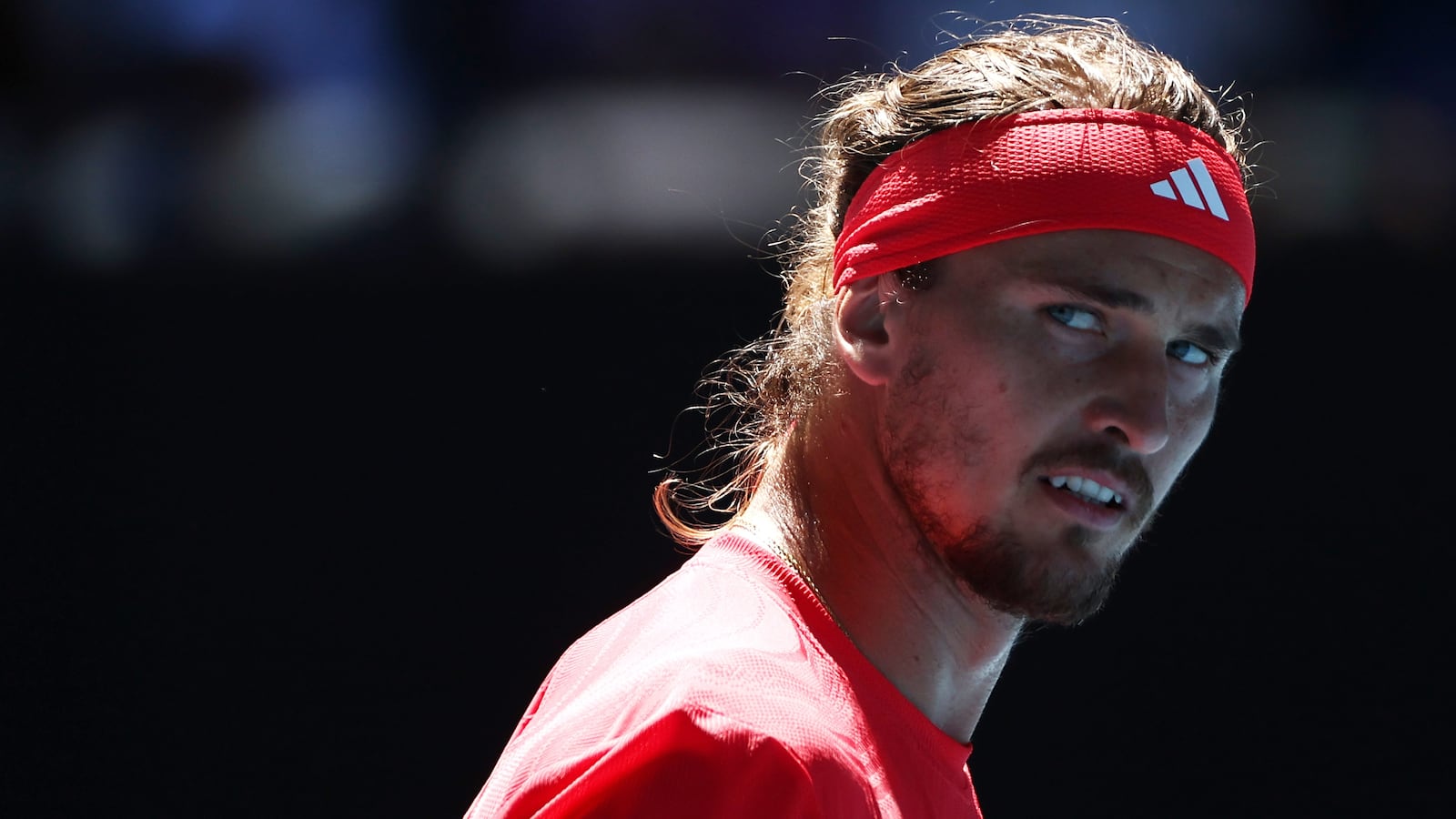 Alexander Zverev of Germany reacts in the Men's Singles Semifinal against Novak Djokovic of Serbia during day 13 of the 2025 Australian Open at Melbourne Park on January 24, 2025 in Melbourne, Australia.