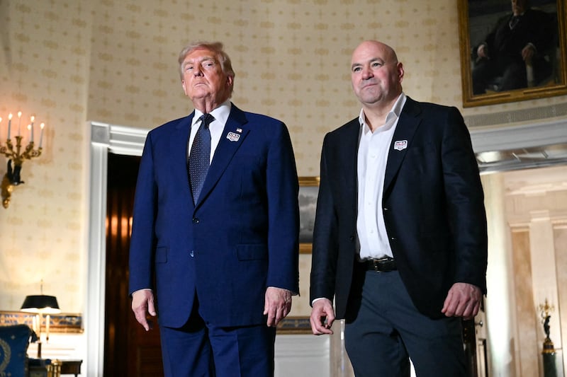 US President Donald Trump and UFC CEO Dana White stand in the Blue Room of the White House as they prepare to walk outside for the "UFC Freedom 250" mixed martial arts event in Washington, DC, June 14, 2026.