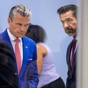 ARLINGTON, VIRGINIA - AUGUST 26: Secretary of War Pete Hegseth (L) and Sean Parnell, Chairman of the Afghanistan Withdrawal Special Review Panel and the Chief Pentagon Spokesman (R), arrive for an event to honor Marines who were serving during the 2021 Abbey Gate bombing at the Pentagon on August 26, 2026 in Arlington, Virginia. Three U.S. Marines from Golf Company have their valor awards formally upgraded to honor their heroism and lifesaving actions during the 2021 Abbey Gate bombing at Hamid Karzai International Airport in Kabul. (Photo by Andrew Harnik/Getty Images)