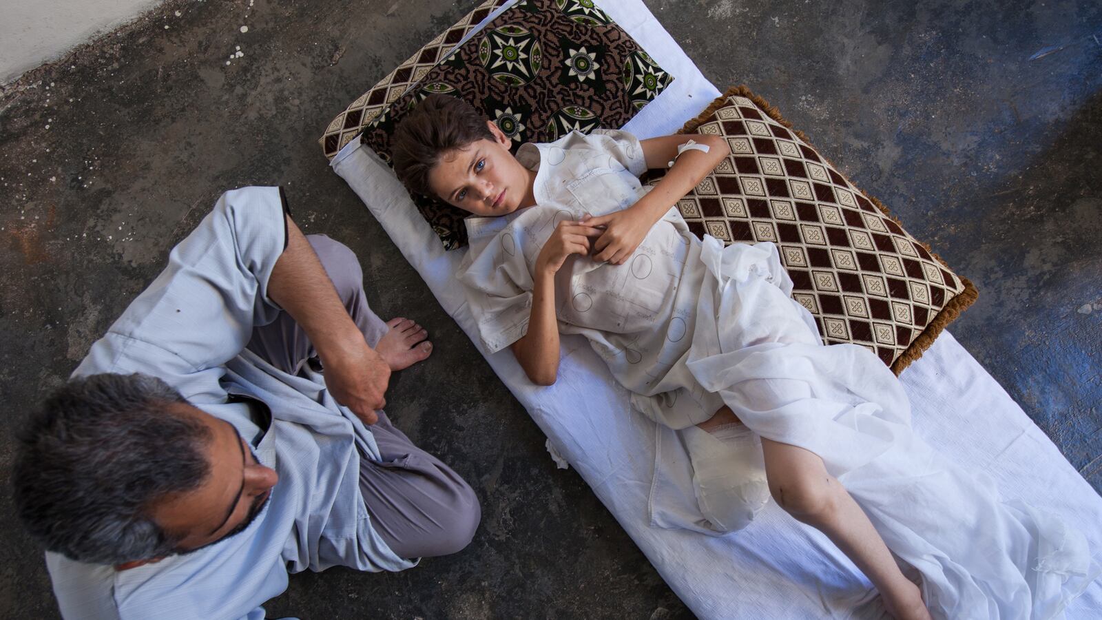 galleries/2013/08/22/syria-s-child-refugee-crisis-hits-one-million-children-displaced-photos/130822-child-refugees-amputation_c6ze3b