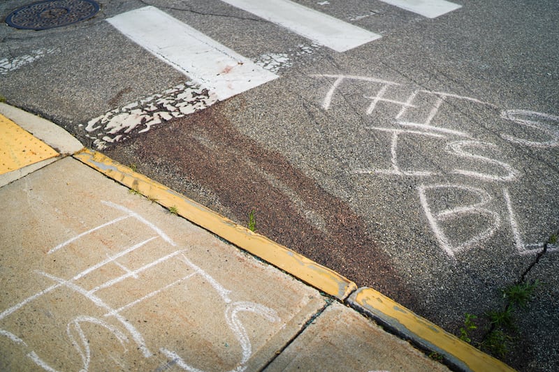 BIDDEFORD, MAINE - JULY 13: Blood is seen on the pavement at the scene of a shooting involving U.S. Immigration and Customs Enforcement (ICE), on July 13, 2026 in Biddeford, Maine. The victim has been identified as Joan Sebastian Guerrero, a 26-year-old man from Colombia. (Photo by Ryan Murphy/Getty Images)