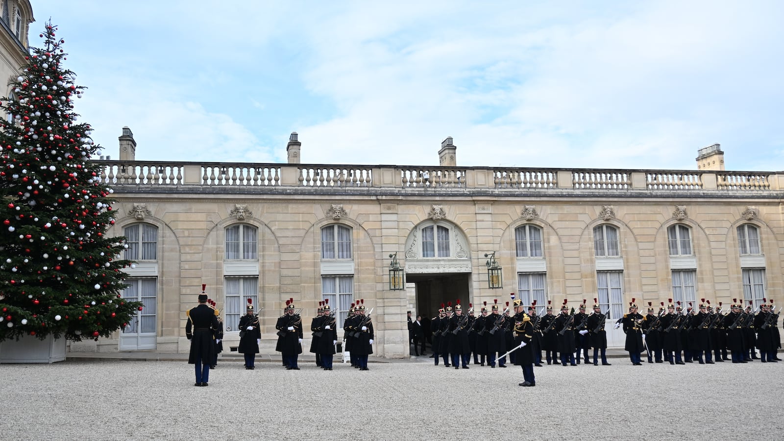 PARIS, FRANCE - DECEMBER 19: French Republican Guard members are seen next to a Christmas tree at the Elysee Presidential Palace in Paris, France on December 19, 2025. (Photo by Mustafa Yalcin/Anadolu via Getty Images)