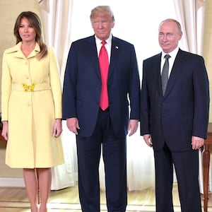 US President Donald Trump (C), Russia's President Vladimir Putin and US First Lady Melania Trump