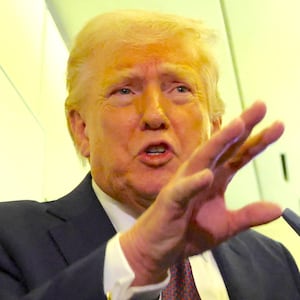 President Donald Trump speaks to reporters aboard Air Force One on a flight back to Washington March 15, 2026.