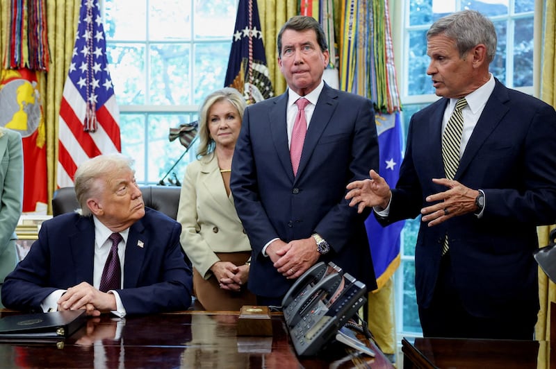 President Donald Trump speaks to Tennessee Gov. Bill Lee during an Oval Office event also attended by the state’s Republican senators,  Marsha Blackburn and Bill Hagerty.