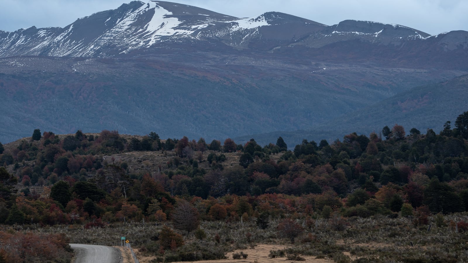 Dirt road to a snowy mountain in Colorado