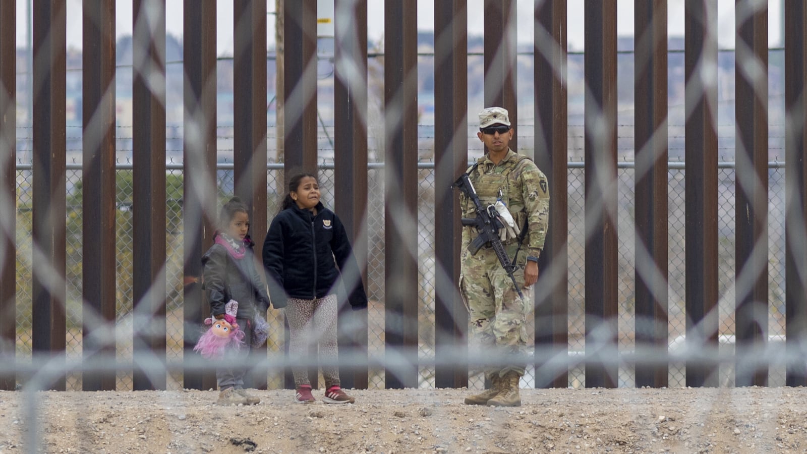 Migrants cross the Rio Grande