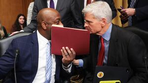 Sen. Bill Cassidy (R) (R-LA) confers with Sen. Tim Scott (C) (R-SC) after the Senate Finance Committee voted to advance the nomination of Robert F. Kennedy Jr. to be the next Secretary of Health and Human Services on February 04, 2025 in Washington, DC. The full committee voted along party lines to advance the nomination to the entire Senate for confirmation.(Photo by Win McNamee/Getty Images)