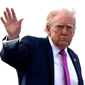 President Donald Trump waves as he boards Air Force One at Palm Beach International Airport in West Palm Beach, Florida, U.S., March 29, 2026.