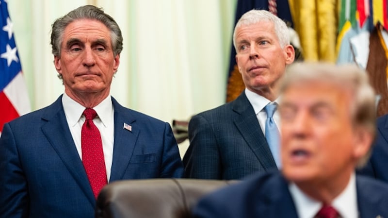 WASHINGTON, DC - JULY 24: U.S. Secretary of the Interior Doug Burgum (L) and U.S. Secretary of Energy Chris Wright (C) listen as U.S. President Donald Trump (R) speaks during an announcement on American nuclear innovation in the Oval Office at the White House on July 24, 2026 in Washington, DC. Trump is signing multiple executive orders targeting the nuclear energy sector and easing rules for new reactors and nuclear fuel supply chains. (Photo by Eric Lee/Getty Images)