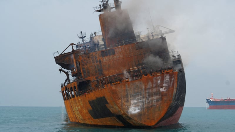 A foreign tanker carrying Iraqi fuel oil damaged after catching fire in Iraq's territorial waters, following unidentified attacks, near Basra, Iraq, March 12.  At least 22 civilian ships — tankers, container ships and other bulk carriers — have been attacked in the last two weeks. REUTERS/Mohammed Aty