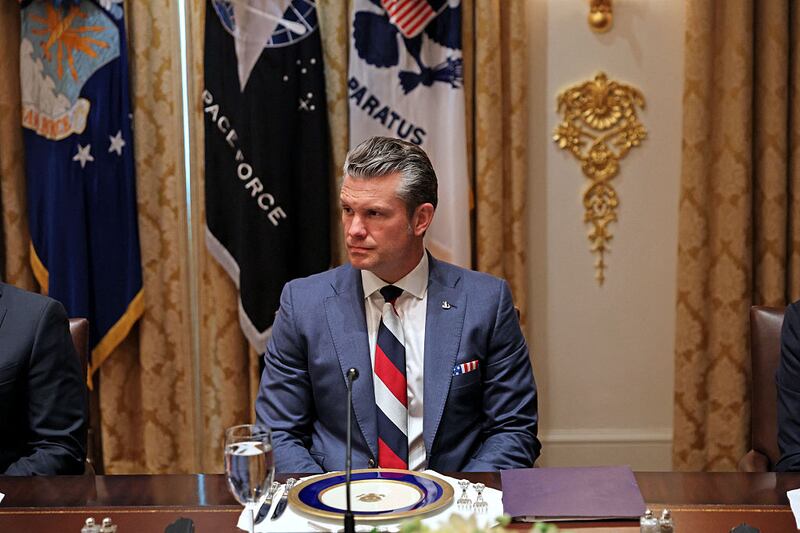 US Secretary of Defense Pete Hegseth looks on as unseen US President Donald Trump meets with unseen Ukrainian President Volodymyr Zelensky in the Cabinet Room of the White House in Washington, DC, on October 17, 2025.