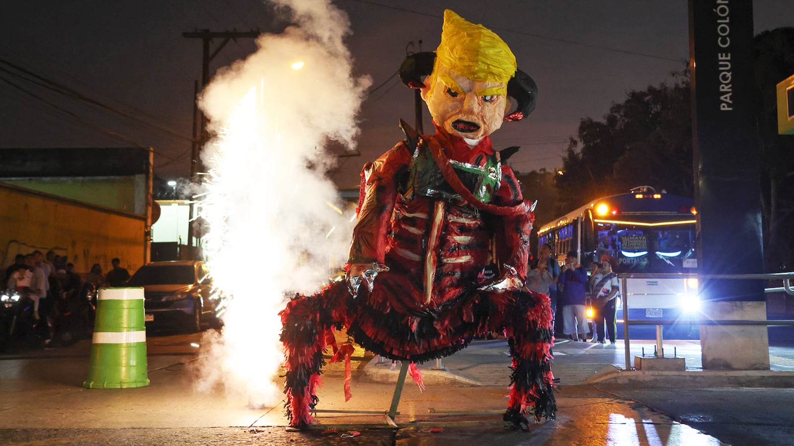 People burn a piñata depicting President Donald Trump during the traditional "Burning of the Devil" in Guatemala City, Guatemala, Dec. 7, 2025.