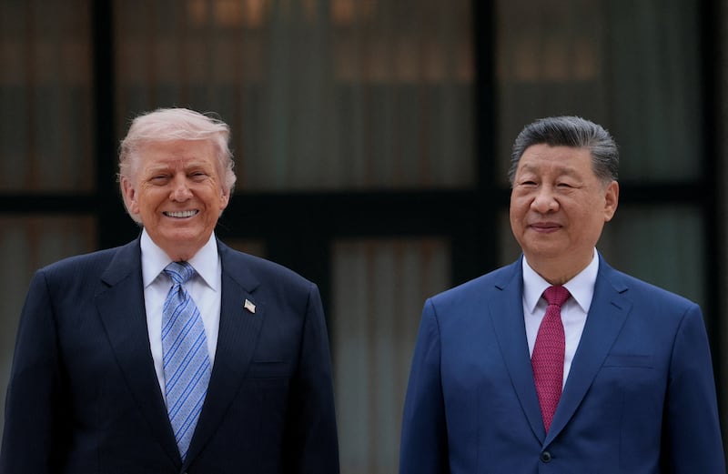 Trump poses for a picture with Chinese President Xi Jinping