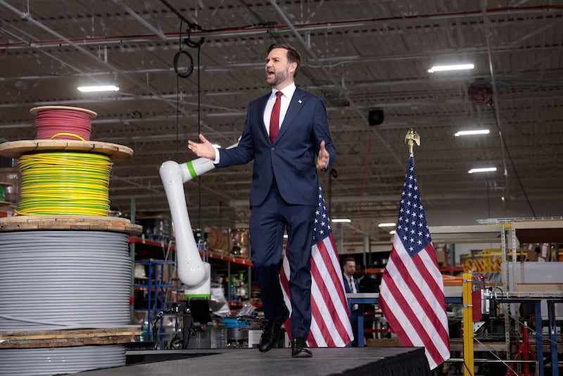 U.S. Vice President JD Vance walks as he prepares to speak in Auburn Hills, Michigan, U.S., March 18, 2026.