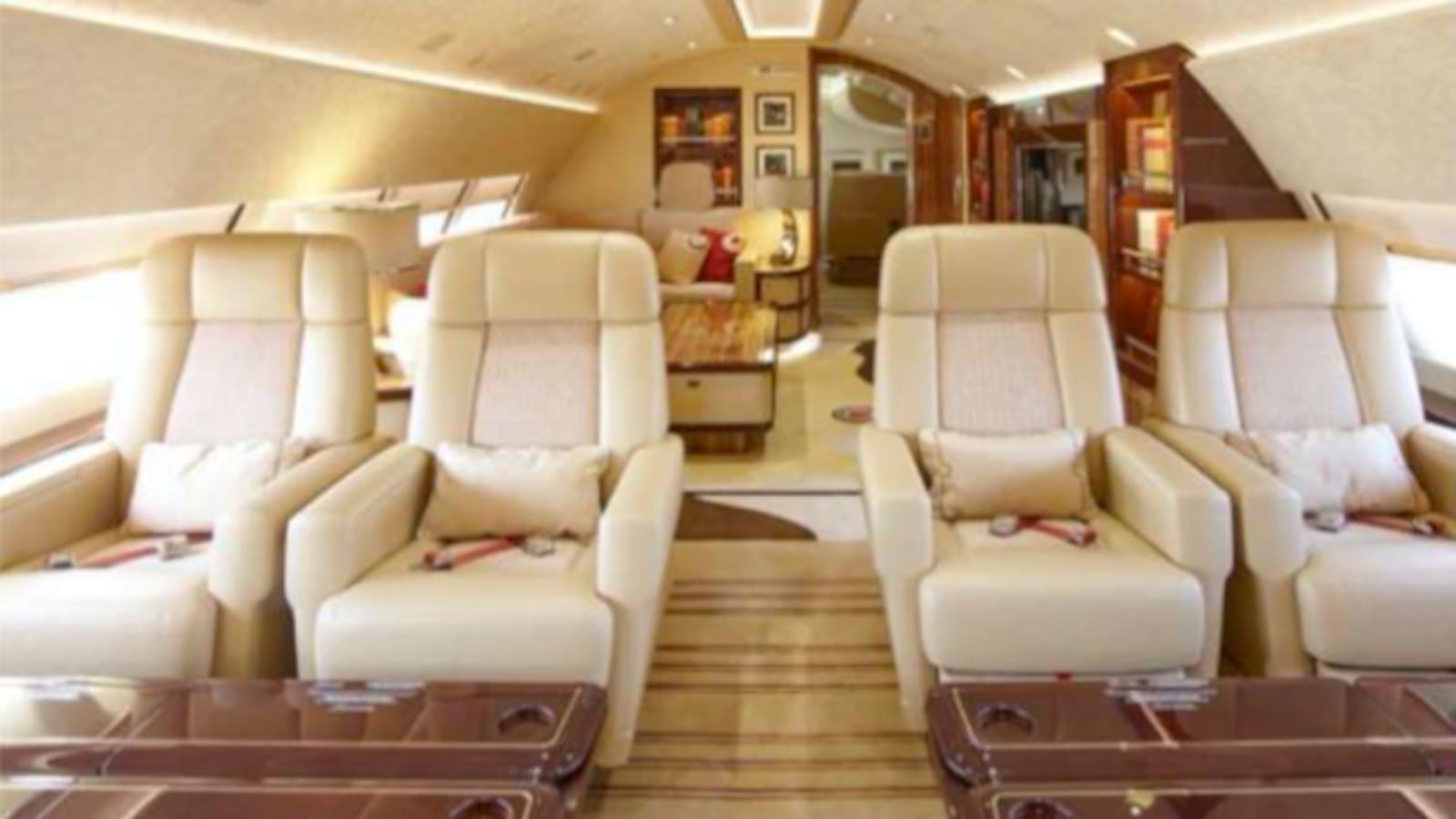 Double seats in the upper deck, with a living room just beyond.