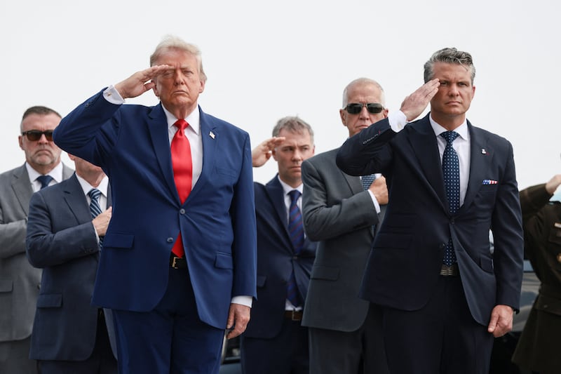 U.S. President Trump and U.S. Secretary of Defense Pete Hegseth salute during a dignified transfer of the remains of U.S. Army service members, Army 1st Lt Tyler James Feehan, Sgt. Angel S. Rampersad, Pvt. Isabella Gonzales, killed during an attack on Muwaffaq Salti Air Base in Jordan, and Sgt. Michael Emmanuel Swinton, killed in action during a controlled detonation of a downed one-way unmanned aerial system at Erbil Air Base in Iraq, at Dover Air Force Base in Dover, Delaware, U.S., July 22, 2026. REUTERS/Evelyn Hockstein