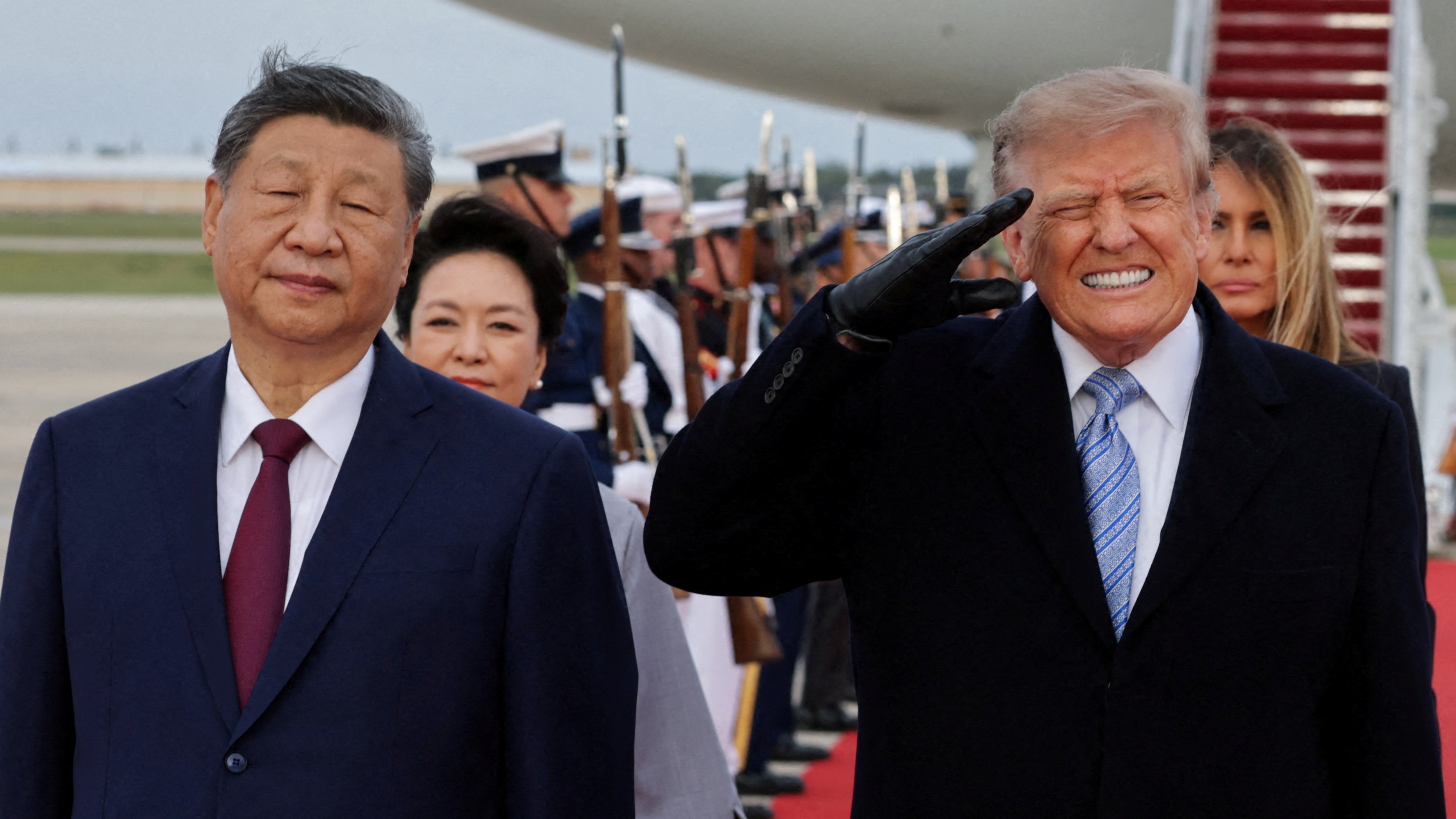 US President Donald Trump salutes next to Chinese President Xi Jinping as he arrives ahead of a state visit at Joint Base Andrews, Maryland, US, September 23, 2026. REUTERS/Jonathan Ernst      TPX IMAGES OF THE DAY