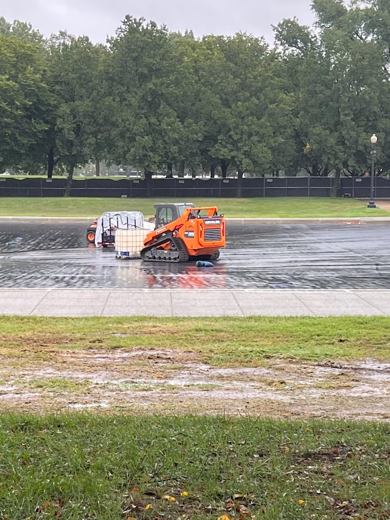 Damaged grass next to the botched Lincoln Memorial Reflecting Pool, which remains empty.