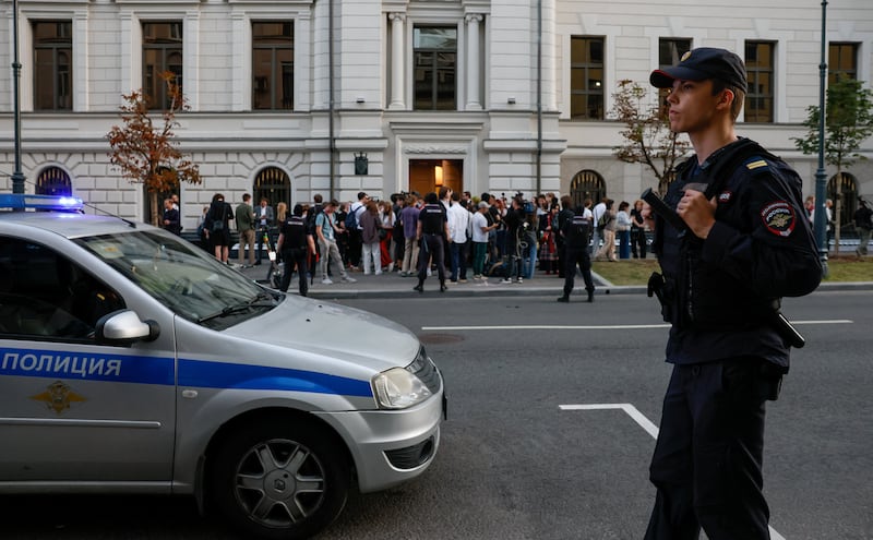 A Russian police officer stands guard outside a building of the Supreme Court, which barred Yabloko political party from contesting September's parliamentary elections over allegations of undeclared funding and breaches of campaigning rules, in Moscow, Russia, August 10, 2026.