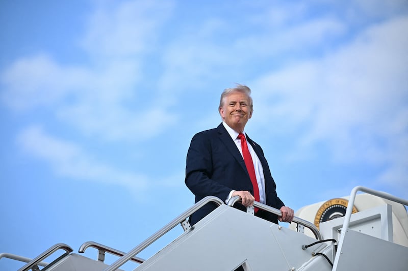 President Donald Trump smiles as he boards Air Force One at Joint Base Andrews in Maryland, on September 11, 2025.