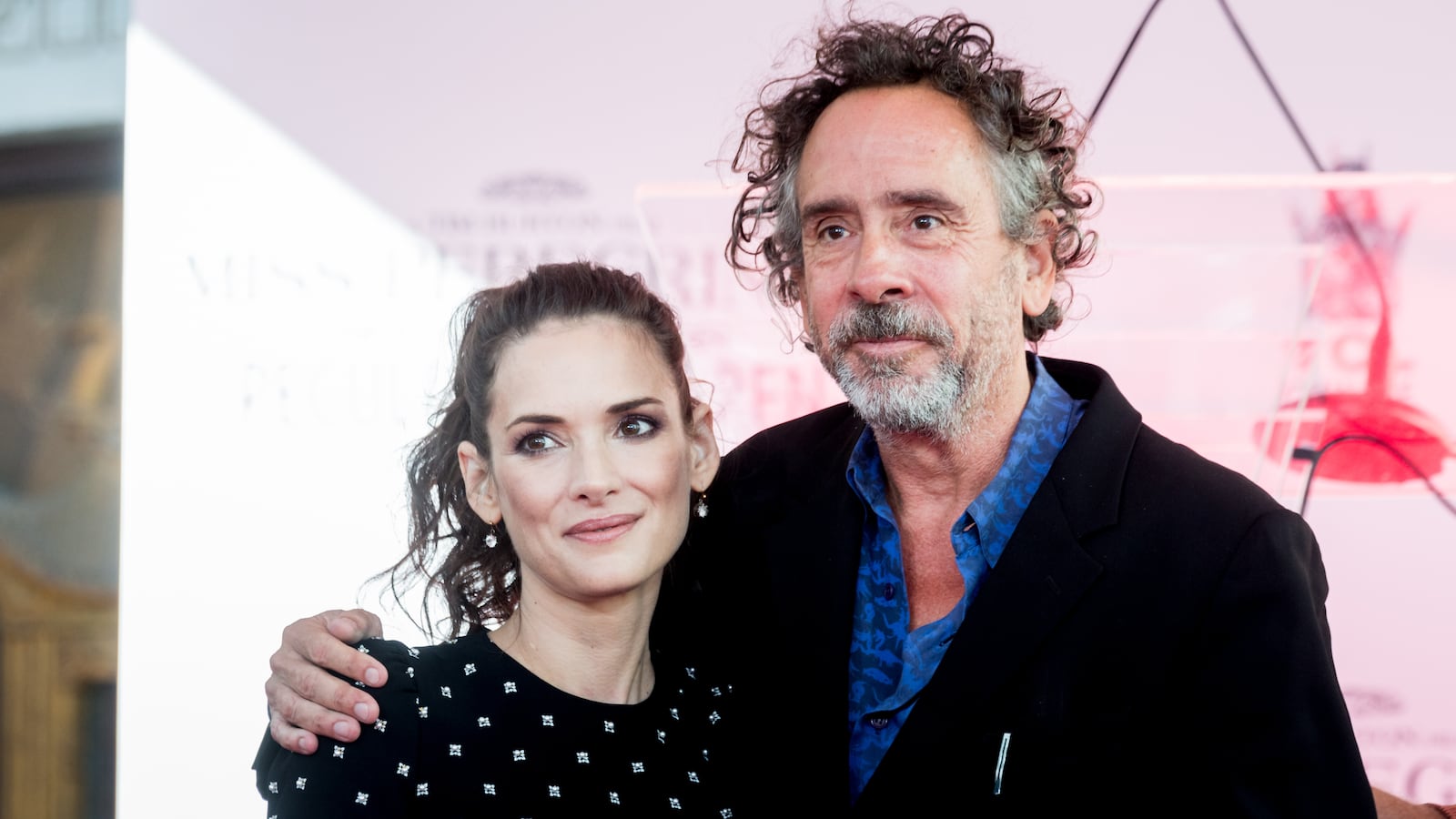 Winona Ryder and director Tim Burton attend the Tim Burton Hand and Footprint Ceremony on September 8, 2016.