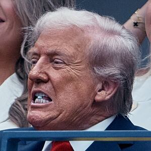 U.S. President Donald Trump takes a tablet as he watches the U.S. Open men’s final between Jannik Sinner and Carlos Alcaraz on Sunday, Sept. 7, 2025, in New York. Photo by. Andres Kudackin** ONE TIME USE ONLY**