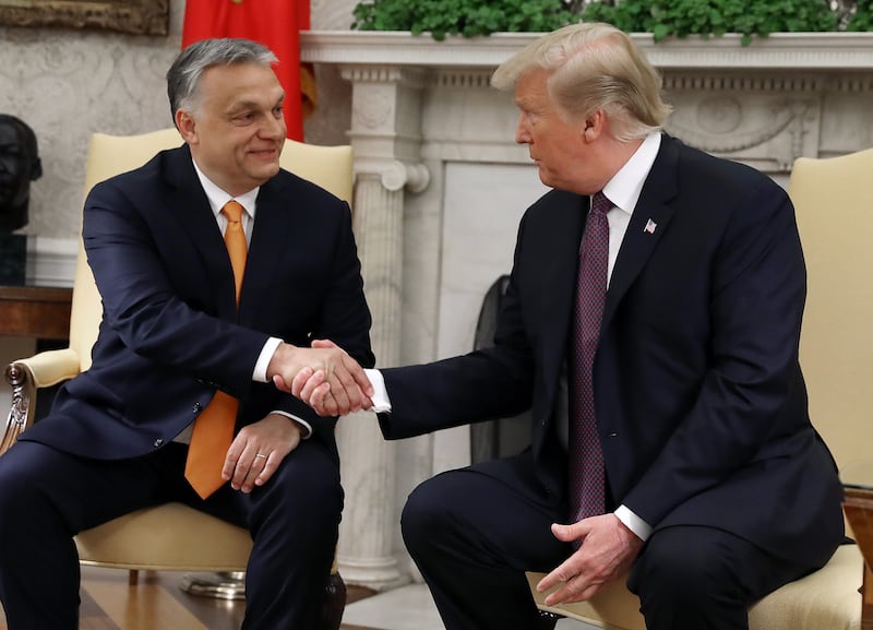 WASHINGTON, DC - MAY 13: U.S. President Donald Trump shakes hands with Hungarian Prime Minister Viktor Orban during a meeting in the Oval Office on May 13, 2019 in Washington, DC. President Trump took questions on trade with China, Iran and other topics. (Photo by Mark Wilson/Getty Images)