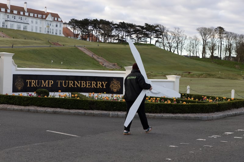 Greenpeace activists install a wind farm on a green of the Trump Turnberry Golf Club,   together with a sign reading ‘Choose wind, dump Trump’.  Polling shows that roughly two-thirds of Scottish voters (65%) believe Britain should not follow US President Donald Trump’s calls for increasing oil and gas extraction and should instead focus on boosting renewable energy.
