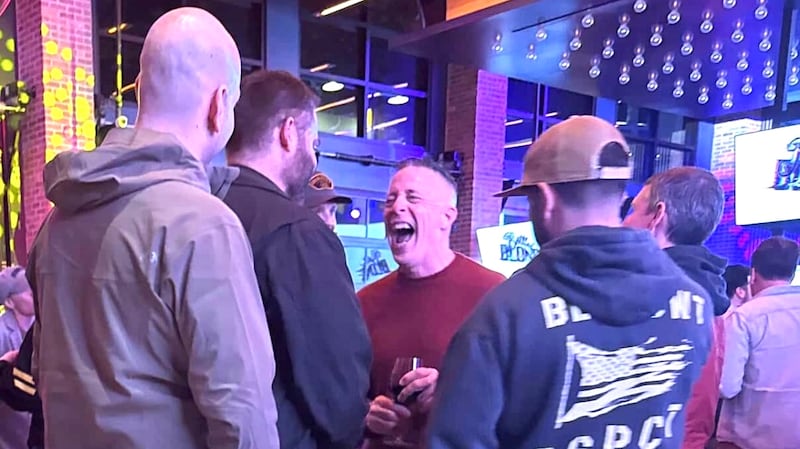 Bovino cackles as he chats to his young male friends.