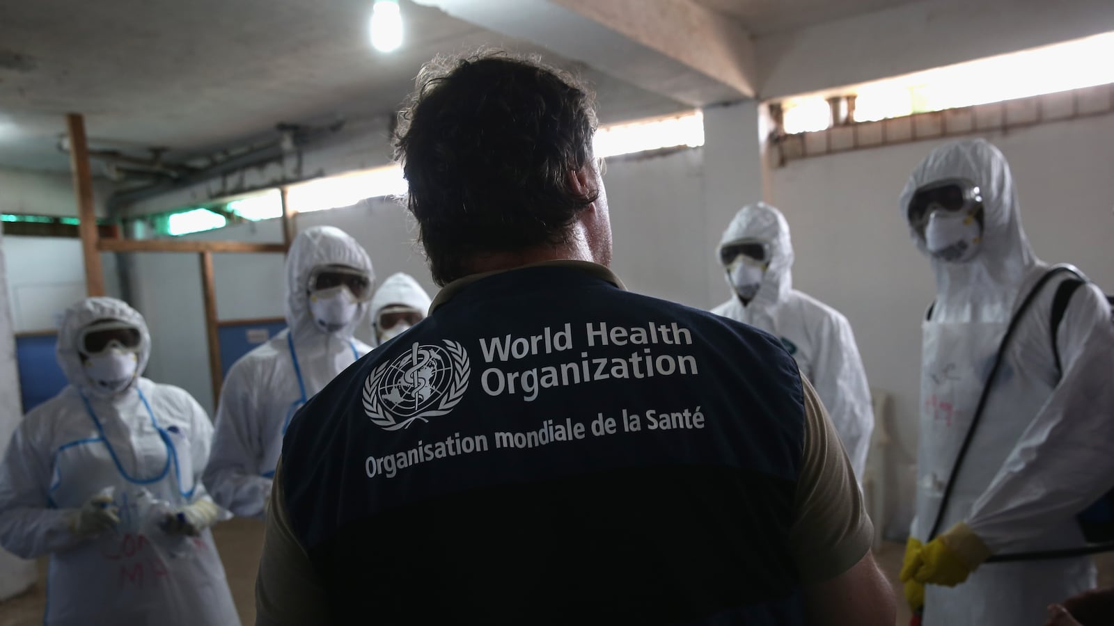 MONROVIA, LIBERIA - OCTOBER 03: A World Health Organization (WHO), instructor teaches new health workers during a training session on October 3, 2014 in Monrovia, Liberia. The WHO is training some 400 new health workers in two-week courses for the Liberian Ministry of Health. Many of the new health workers will be stationed in some of th 17 Ebola treatment units to be built by the U.S. military. (Photo by John Moore/Getty Images)