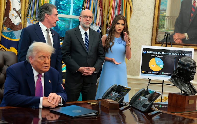 Secretary of Homeland Security Kristi Noem (R), joined by President Donald Trump, Interior Secretary Doug Burgum and Director of the Office of Management and Budget Russell Vought, delivers remarks during an event on natural disaster preparedness in the Oval Office at the White House on June 10, 2025 in Washington, DC. Trump said he wants to eliminate the Federal Emergency Management Agency (FEMA) and return its function to the state level.